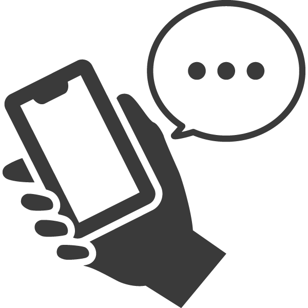 予約の電話をしているスマホを握る手